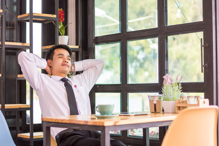 Businessman relaxing in a cafe.の写真素材