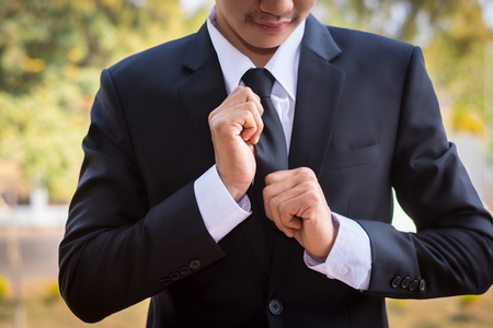 Businessman wearing a suit in a cafe.の写真素材
