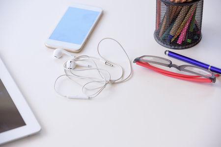Work space top view with mobile phones, communication technology.の写真素材