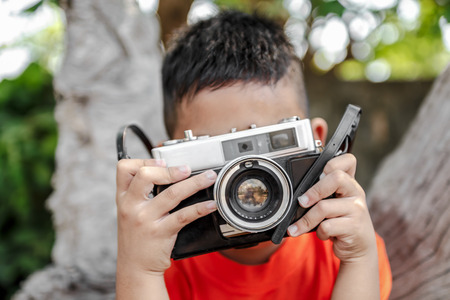 boy with camera retroの写真素材