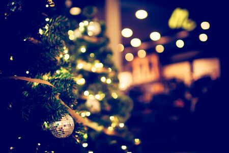 Colorful christmas tree light bokeh and blured in shopping mallの写真素材