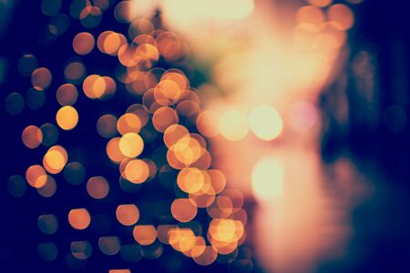 Colorful christmas tree light bokeh and blured in shopping mallの写真素材