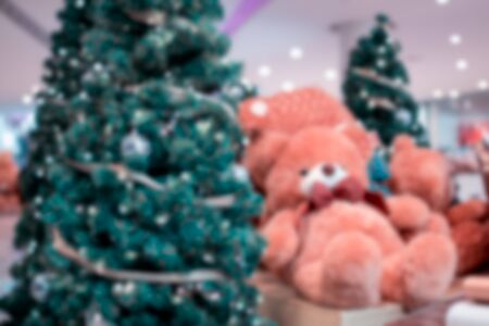 Colorful christmas tree light bokeh and blured in shopping mallの写真素材
