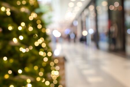 Colorful christmas tree light bokeh and blured in shopping mallの写真素材