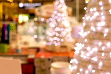 Colorful christmas tree light bokeh and blured in shopping mallの写真素材