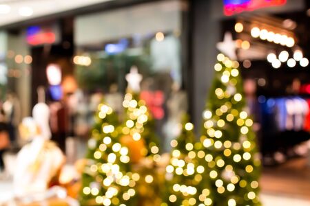 Colorful christmas tree light bokeh and blured in shopping mallの写真素材