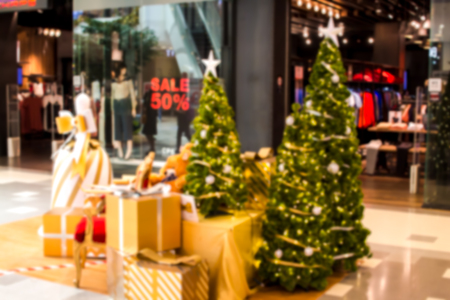 Colorful christmas tree light bokeh and blured in shopping mallの写真素材