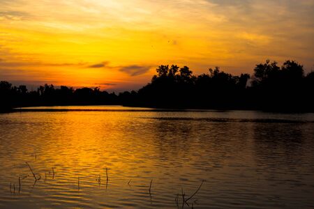 fisherman silhouette at moonnoi in thailandの写真素材