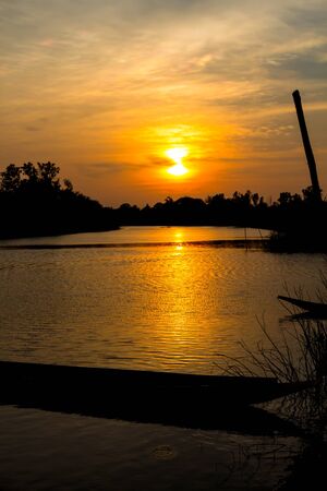 fisherman silhouette at moonnoi in thailandの写真素材