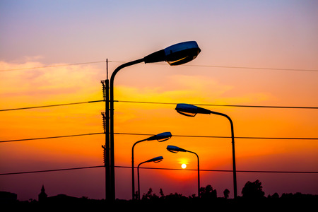 Silhouette Electric Lamp Whith Sunsetの写真素材