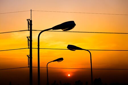 Silhouette Electric Lamp Whith Sunsetの写真素材