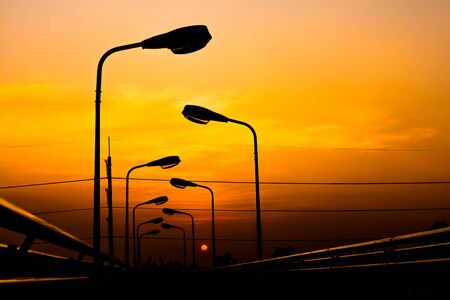 Silhouette Electric Lamp Whith Sunsetの写真素材