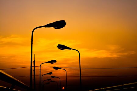 Silhouette Electric Lamp Whith Sunsetの写真素材
