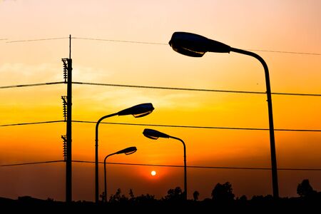 Silhouette Electric Lamp Whith Sunsetの写真素材