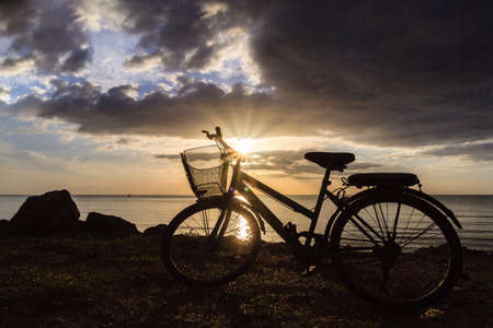 Silhouette of a bike at sunshineの写真素材