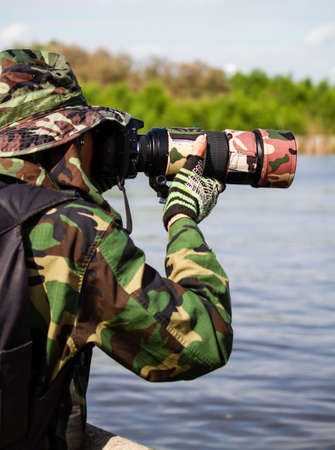 Photographer taking photo in wild の写真素材