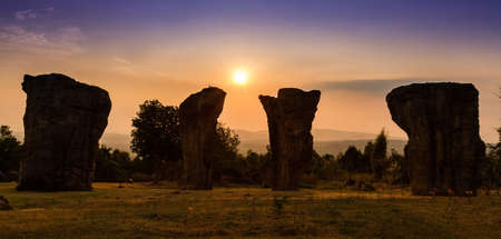 Stone head thailand at sunriseの写真素材
