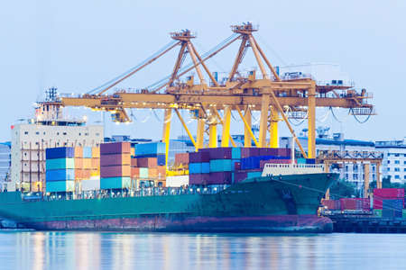 Industrial Container Cargo freight ship with working crane  の写真素材