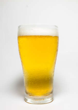Frosty glass of light beer isolated on a white backgroundの写真素材