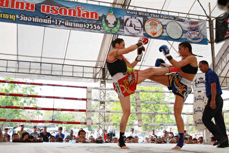 AYUTTHAYA, THAILAND- MARCH 17 : Thai boxing match at Muay Thai Fight Fastival on March 17, 2013, Moless (France) RED vs Tobe (Sweden) BLUE,Tobe (Sweden) BLUE is winner in Ayutthaya, Thailand.のeditorial素材