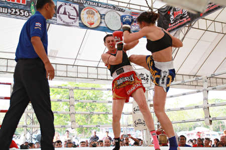 AYUTTHAYA, THAILAND- MARCH 17 : Thai boxing match at Muay Thai Fight Fastival on March 17, 2013, Moless (France) RED vs Tobe (Sweden) BLUE,Tobe (Sweden) BLUE is winner in Ayutthaya, Thailand.のeditorial素材