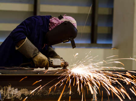 Electric wheel grinding on steel structureの写真素材