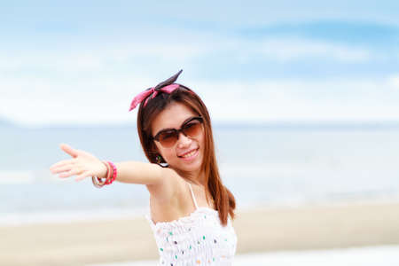 Portrait of young woman on the beachの写真素材