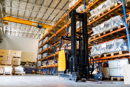 Modern warehouse with forklifts のeditorial素材
