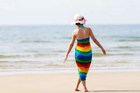 Woman in a dress on the ocean coast の写真素材