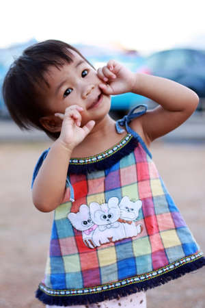 Portrait of a little Asian baby child girl の写真素材