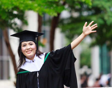 Graduation asian girls with congratulationの写真素材