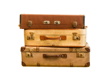 Pile of old vintage bag suitcases on isolate background の写真素材