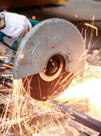 Closeup of a metal cutting steel pipe  