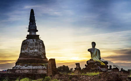Stone statue and Pagoda of a Buddha , Ayutthaya Province ,Thailand  の写真素材