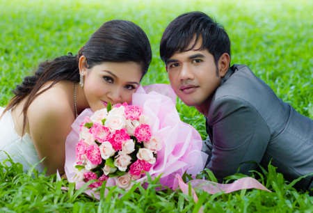 Couples of groom and bride with bouquet flowersの写真素材