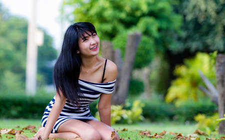 Beautiful Asian model outdoors smiling の写真素材
