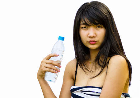Beautiful woman with bottle of waterの写真素材