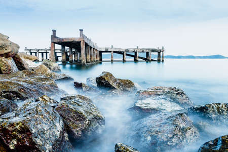 Old jetty and rocksの写真素材