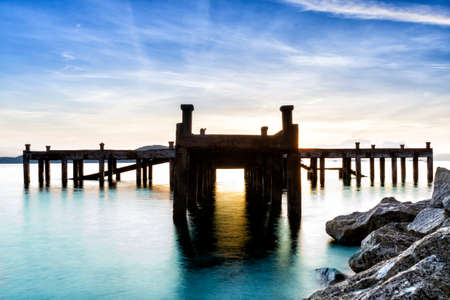 Calm scene detail of old jetty at twilight の写真素材