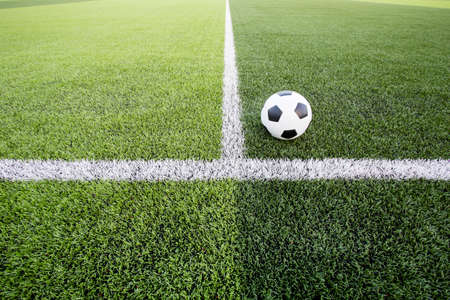 Soccer ball on green field