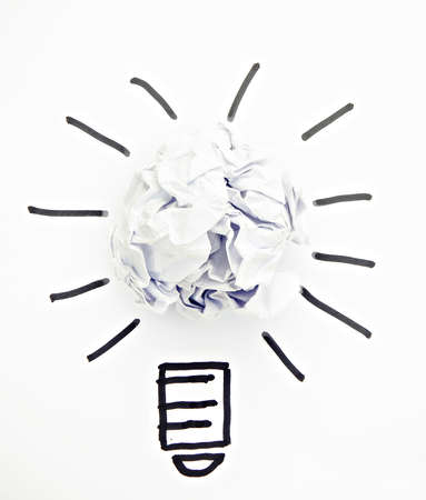 Inspiration concept crumpled paper light bulb metaphor for good idea の写真素材