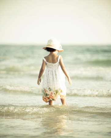 little girl on beach vacation  Vintage stye の写真素材