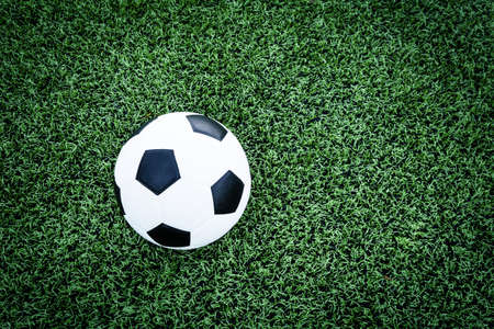 Soccer ball on soccer field の写真素材
