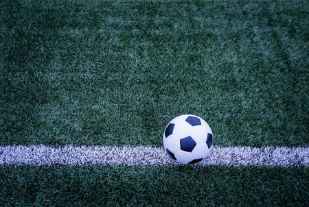 Soccer ball on soccer field の写真素材