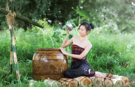 Young Asian Woman Bathing in tropical the summertimeの写真素材