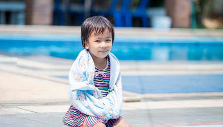Little girl in swimming poolの写真素材
