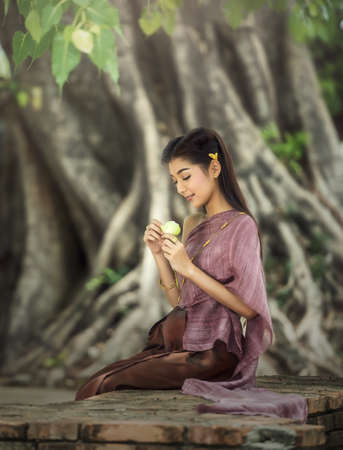 Woman wearing typical Thai dress identity culture of Thailandの写真素材
