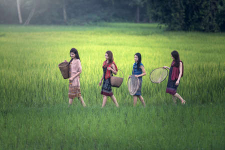 Beautiful Thai local happy women working outdoor, Thailandの写真素材