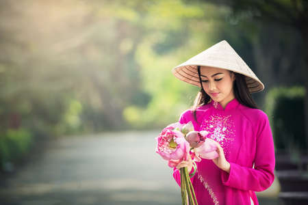 Beautiful woman with Vietnam culture traditional, Ao dai is famous traditional costumeの写真素材