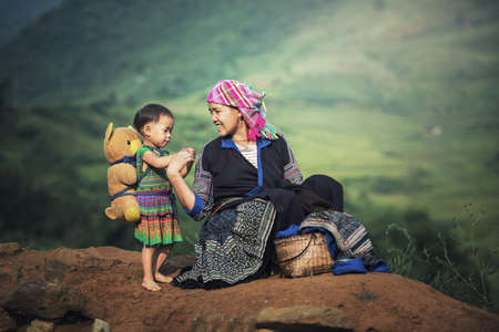 Mother and daughter in rice terraces,Tu Le Lao Cai,Vietnamの写真素材